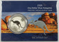 Silver kangaroo coin in packaging on a purple surface